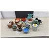 Image 1 : Assorted Pottery & Ceramics: 4 Brugal Coconut Cups, 2 Blue & Black Mugs, & More