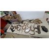 Image 1 : Antique Horseshoes, Two-Handled Drawknife, Cast Iron Pulley, Rope Halter and More