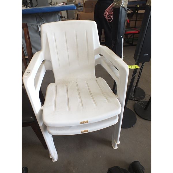 Two White Plastic Chairs