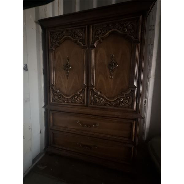 Wooden Armoire With Carved Detail