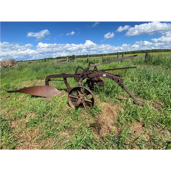 Single btm breaking plow on steel wheels