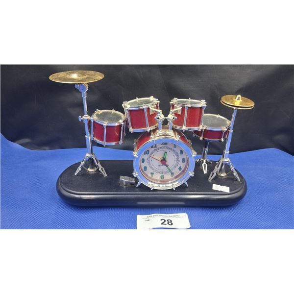 Vintage drum set clock, super cool! Plays music, base is 10"