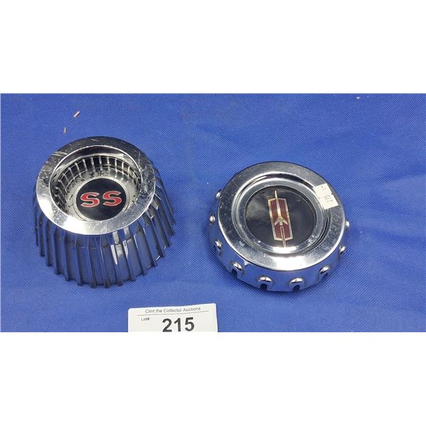 2 vintage center hub caps, one Oldsmobile, one SS