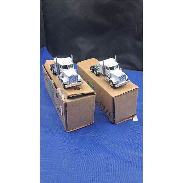 2 NIB semi trucks, each 6"