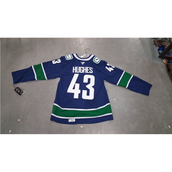 Brand new adult jersey with tags, Hughes 43
