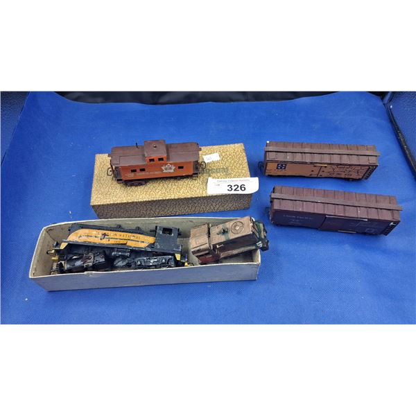 3 boxes of 1950s train pieces