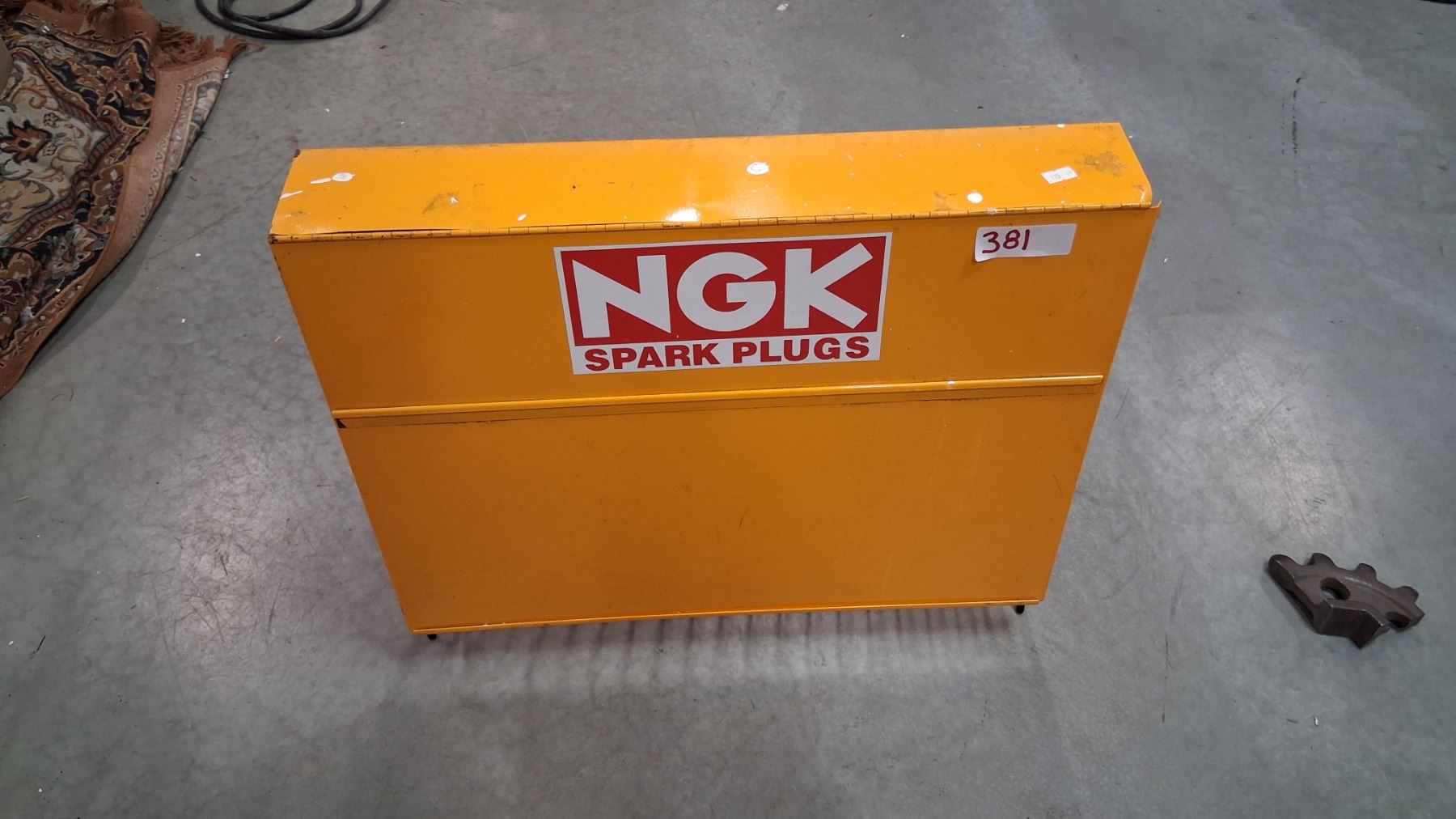 Vintage NGK spark plug metal display stand 23