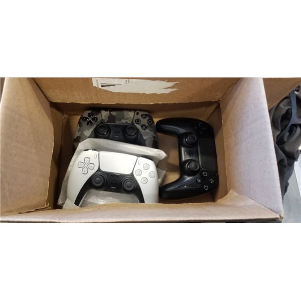 3 PS 5 CONTROLLERS. WHITE BLACK AND CAMO