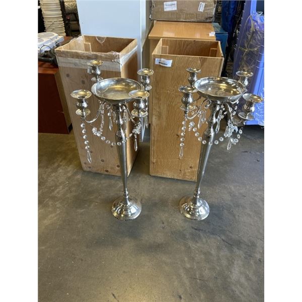 TWO EVENT CANDLE STANDS WITH PLYWOOD TRANSPORT BOXES. MUST TAKE ALL