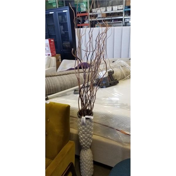 BUNDLE OF STICKS IN DECORATIVE VASE