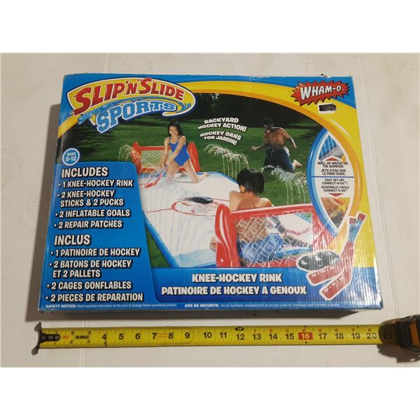 Wham-O Slip N Slide Sports Knee Hockey Rink is a backyard water game.