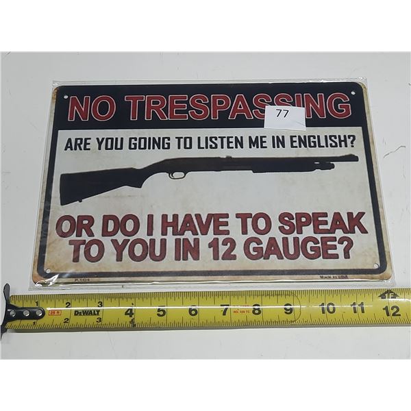 "No Trespassing" sign with aggressive, threatening messaging. It features a shotgun and the text: "A