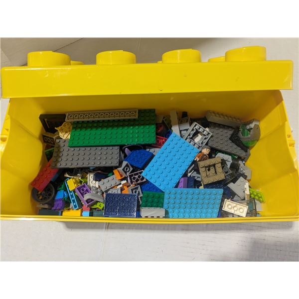 bin of mixed lego pieces