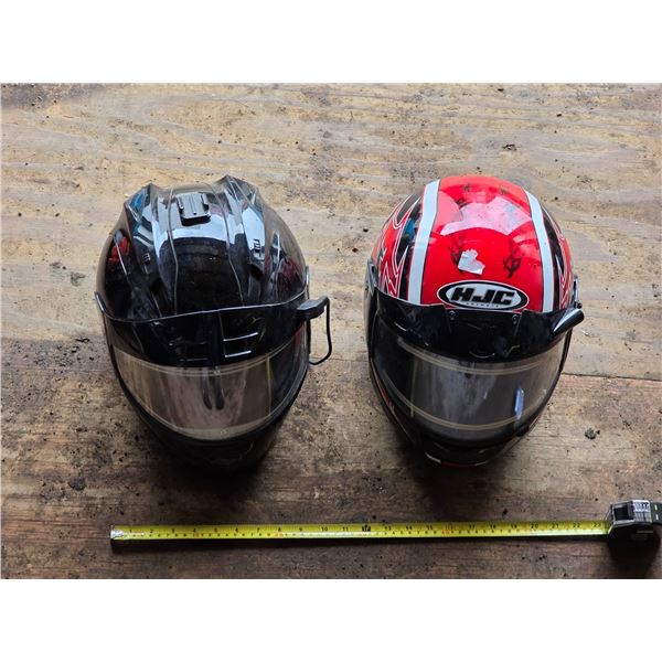 2 motor cycle helmets
