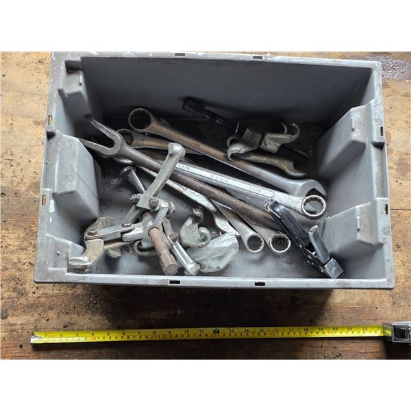 Tote with large wrenches and pully