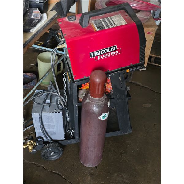 Lincoln electric welder on a cart with spare gas tank