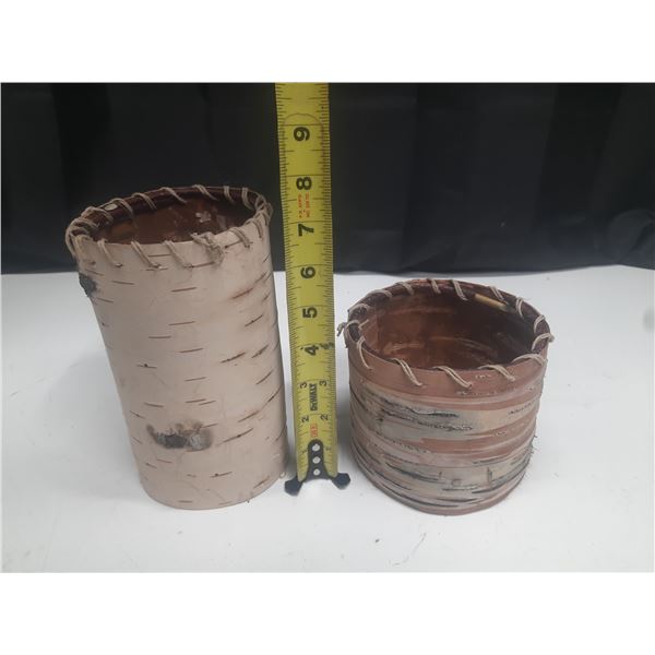 Traditional birch bark containers or baskets, often handcrafted and used for storage or decoration.