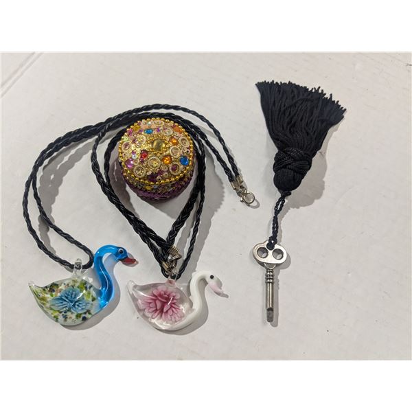 jewelry box, 2 swan necklaces, key