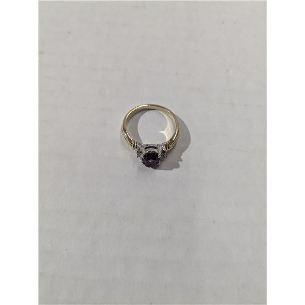 gold tone ring with purple stone