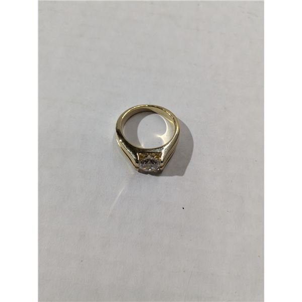 gold tone ring with clear stone