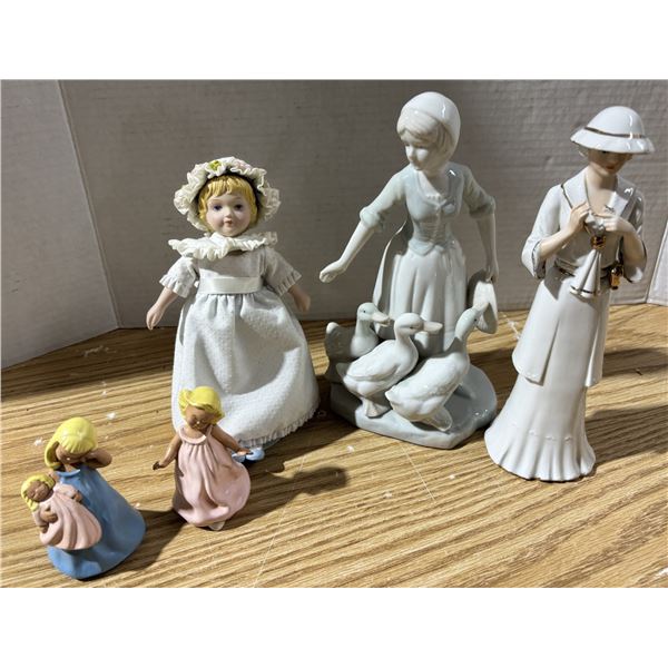 (2) large ceramic female statues, (2) small ceramic statues, (1) small doll on a stand