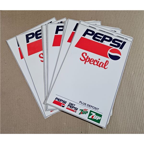 Stack of Pepsi Advertising Signage