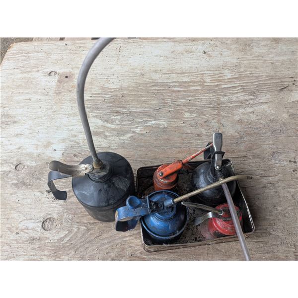 5 vintage pump oil cans