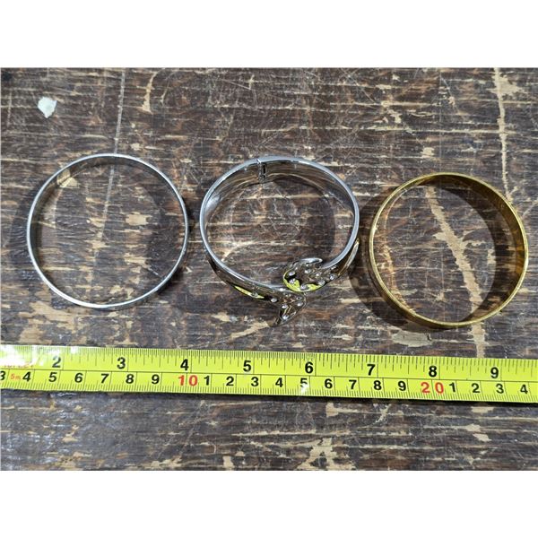 3 bracelets- silver and gold colored