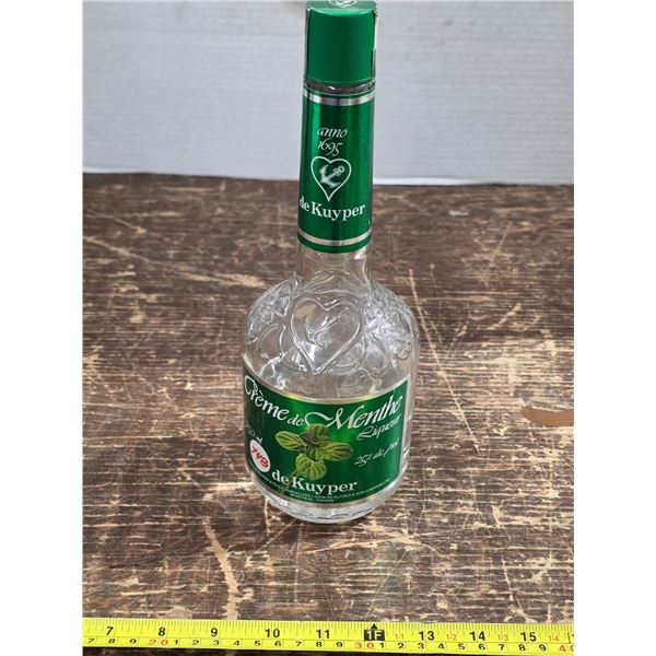 Bottle of cream de menthe- 25%- half full