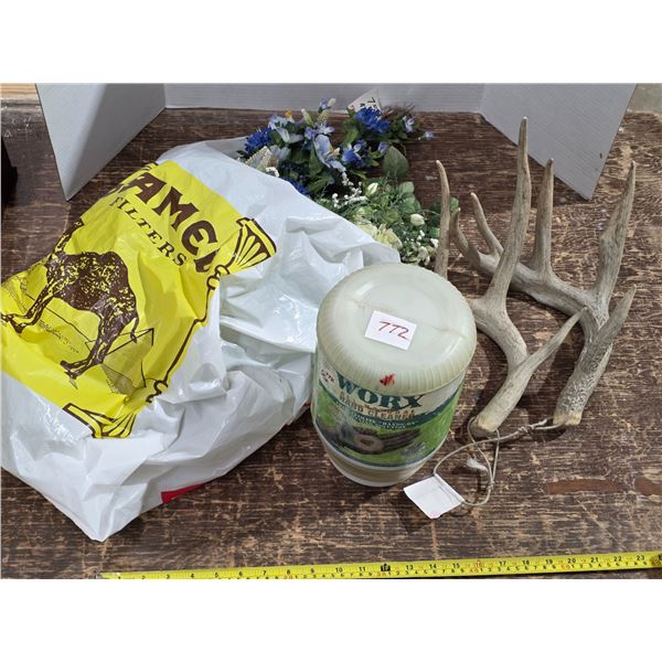 Antlers, fake flowers, hand cleaner