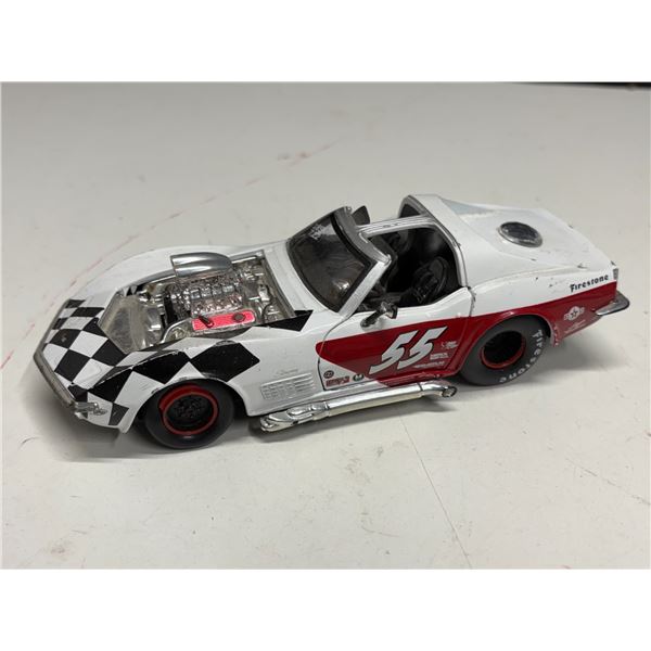 1970 Chevrolet Corvette, featuring a distinctive black and white checkered racing livery.