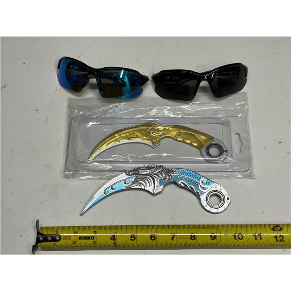 (2) decorative, non-sharp Karambit-style toy knife often used for cosplay, display, or fidgeting and