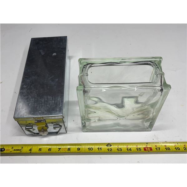 Clear glass block vase and stainless steel cash or locker box.