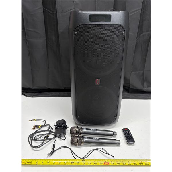 JYX-T9 portable karaoke speaker features a large black grill and includes two wireless microphones a
