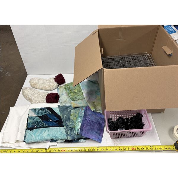 Lot of Fabrics and pink plastic basket likely holds black plastic connectors used for assembling wir