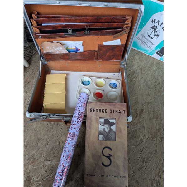 vintage suitcase with paint supplies and cd box set