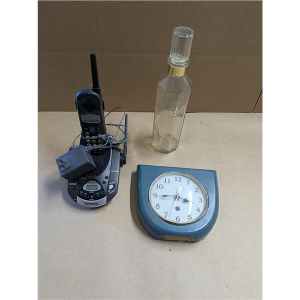 cordless phone, clock, decorative bottle