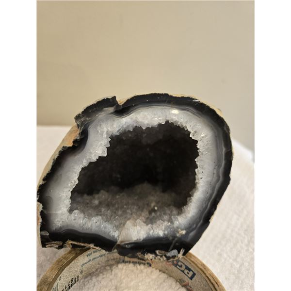 Brazilian agate geode.  Tan exterior, cavity lined with white quartz crystals. 3 1/2" tall, 3 1/2" a