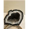 Image 2 : Brazilian agate geode.  Tan exterior, cavity lined with white quartz crystals. 3 1/2" tall, 3 1/2" a