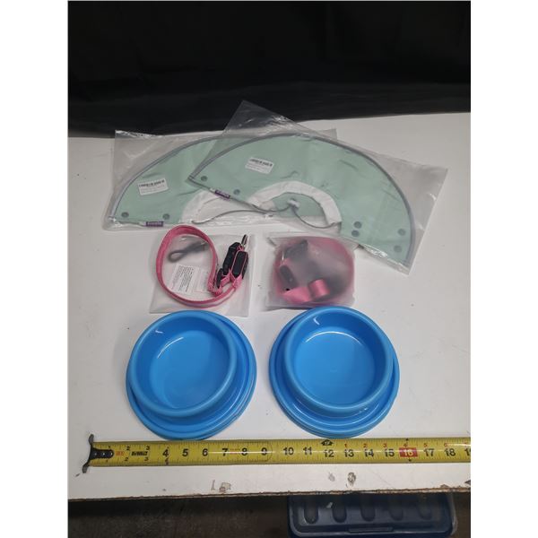 Collection of pet supplies. (2) Pet Bowls, (2) LED Dog Harnesses (Size Large) and (2) Pet Recovery C