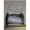 Image 1 : White soccer shin guards feature a hard protective shell and come packaged with sleeves protectors. 