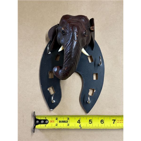 Vintage-style decorative wall hanging elephant.