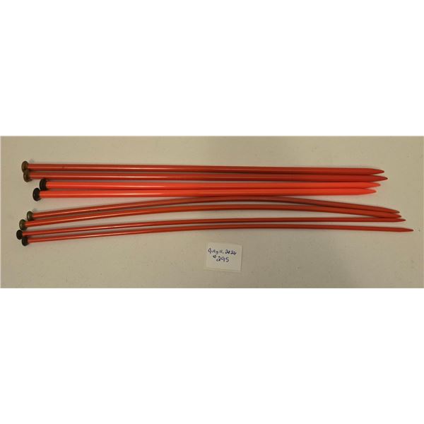 Four Sets of Red Knitting Needles