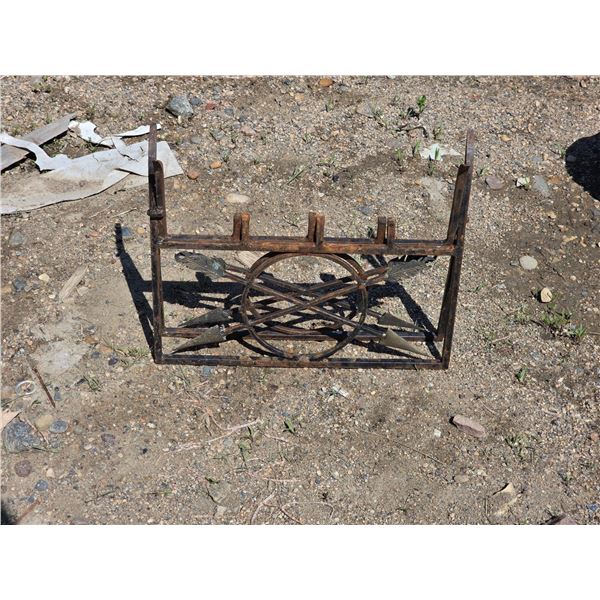 Wrought iron and brass log sitter