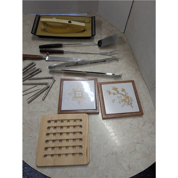 kitchenware- pot holders,nut crackers, roasting tools, Vintage philips electric bread saw/knife