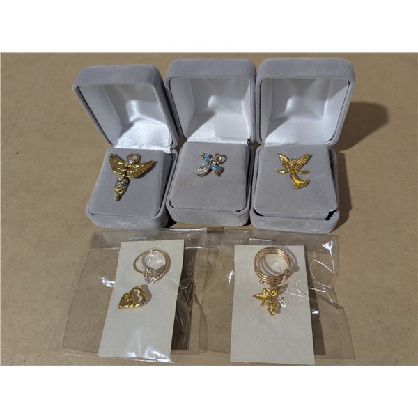 jewellery - gold tone rings and 5 pins, religious