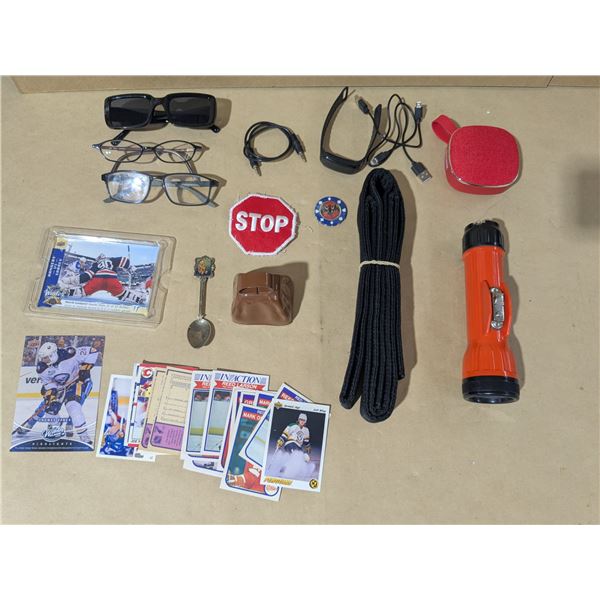 mixed lot- bluetooth speaker, fitness tracker, flashlight, sports cards, reading glasses