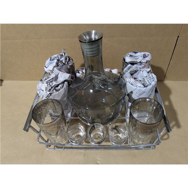 liquor decanter with glasses and mixed shot glasses