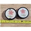 Image 1 : 2 olympic hockey pucks