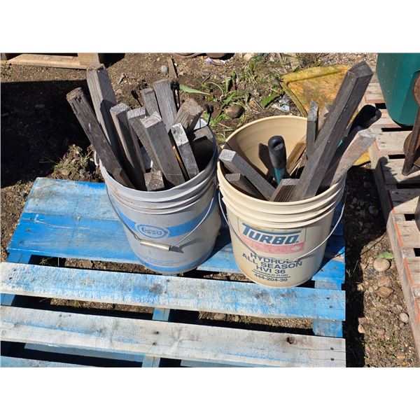 2 buckets of wood scrap and tools, axe and branch trimmer